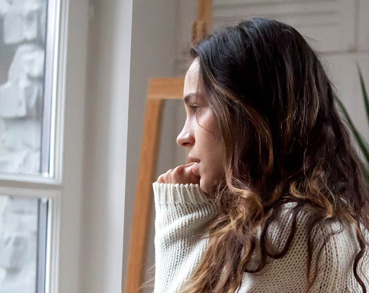 Woman Looking Out of Window